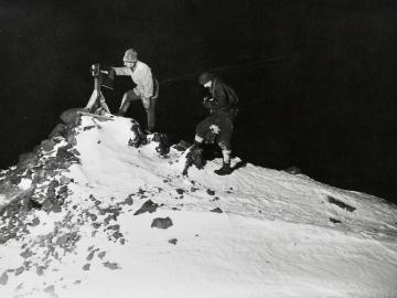 Dr Wilson and Lieut. Bowers reading the ramp thermometer in the winter night, -40°Fahr
