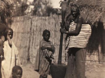 Woman pounding millet, Dakar