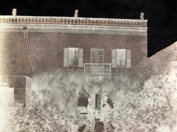 Mr Bradbury and his son in front of the photographer's House at Sliema, Malta