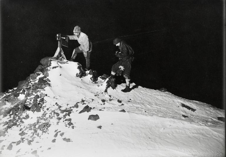 Dr Wilson and Lieut. Bowers reading the ramp thermometer in the winter night, -40°Fahr